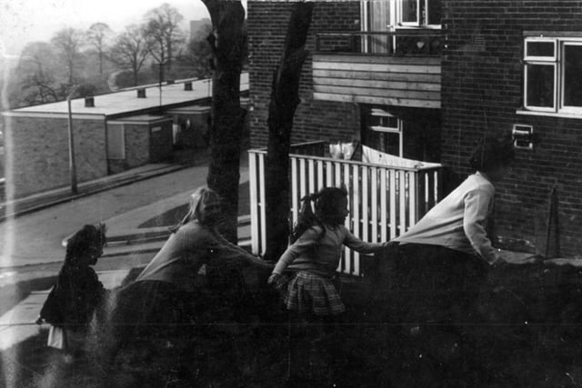 Children playing outside flats in Gleadless Valley, Sheffield, in the 1960s