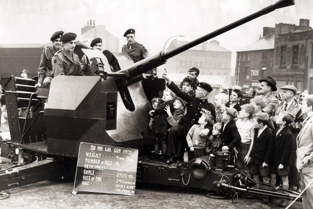 Youngsters enjoying the Territorial Army Jubilee celebrations at Fitzwilliam Street, Sheffield...July 1958