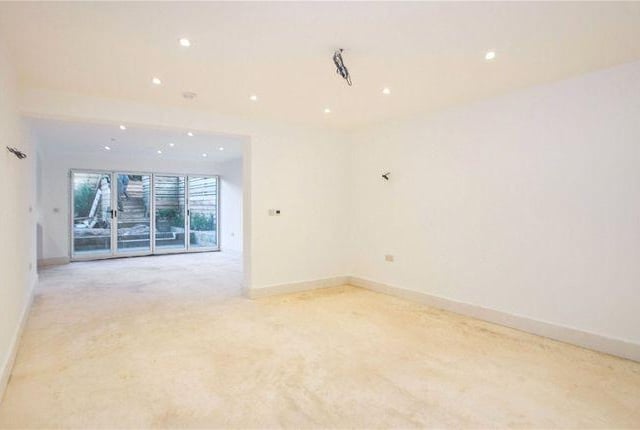 This open plan space has glass doors onto the garden.