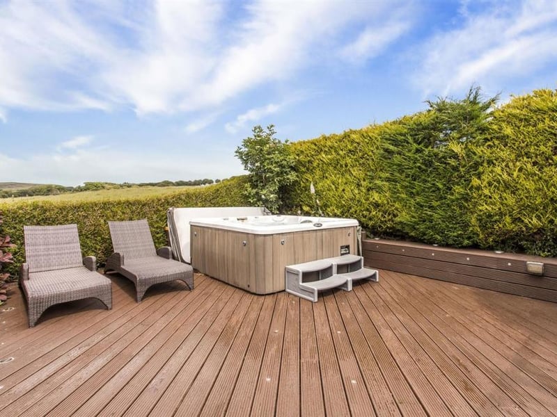 Decking area with hot tub.