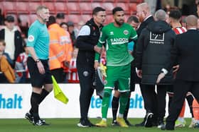 Sheffield United boss Paul Heckingbottom leads Wes Foderingham away following his red card after the final whistle against Blackpool at Bramall Lane: Simon Bellis / Sportimage