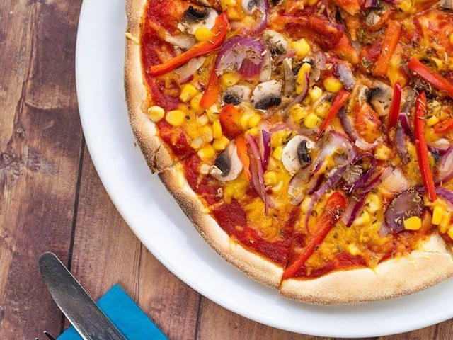 Stonehouse Pizza has a full separate menu for its pizzas alone, including offerings like classic margherita, signature pizzas like southern fried chicken and bacon, and calzones, like the mac and cheese pizza calzone