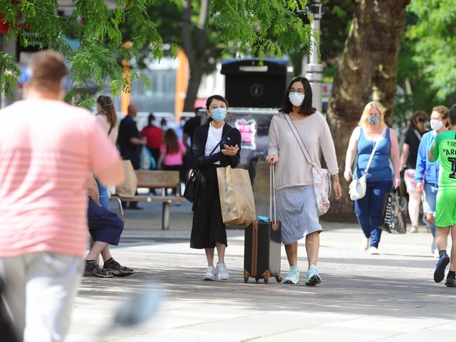 Shoppers wear face masks as they return to Commercial Road in Portsmouth as stores reopen. Picture: Sarah Standing (150620-4150)