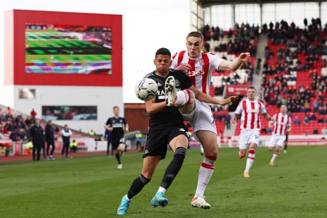 Taylor Harwood-Bellis of Stoke City challenges Will Osula of Sheffield United: Darren Staples / Sportimage