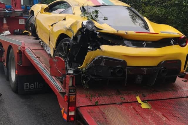 The yellow Ferrari was wrecked in the crash.