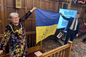 Sheffield Lord Mayor Sioned-Mair Richards and Oleksandr Symchyshyn, mayor of Khmelnytskyi, holding a Ukrainian flag signed by fighters on the front line at an official twinning ceremony held during a Sheffield City Council meeting. Picture: LDRS