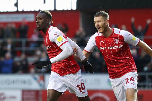 Rotherham United's Freddie Ladapo (left) celebrates scoring their side's first goal of the game during the Sky Bet League One match at the AESSEAL New York Stadium, Rotherham.  Isaac Parkin/PA Wire.