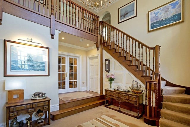 The entrance of the property opens out to a magnificent central hallway, which is open and spacious and features a hardwood staircase leading to the upper floor.