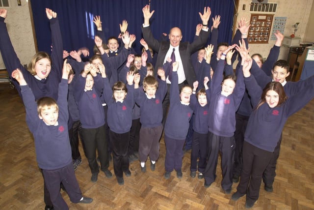 Stocksbridge Junior School headteacher Dave Foster and his pupils celebrate the school's Ofsted report in 2003