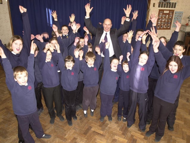 Stocksbridge Junior School headteacher Dave Foster and his pupils celebrate the school's Ofsted report in 2003