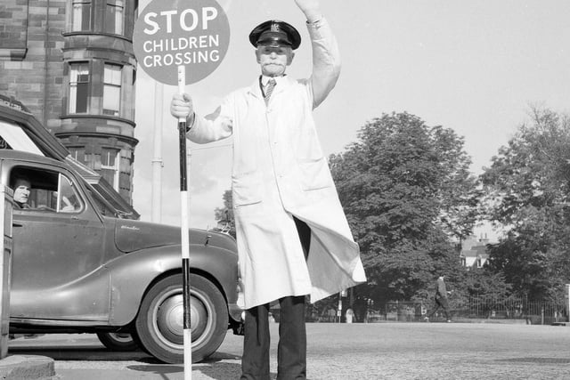 Lollipop man John Thomson on Morningside Road in December 1964.