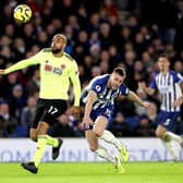 Sheffield United's David McGoldrick (left) and Brighton and Hove Albion's Adam Webster battle for the ball during the Premier League match at the AMEX Stadium, Brighton: Gareth Fuller/PA Wire.
