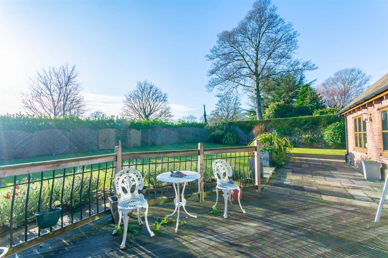 Morning coffee or evening drinks with garden views on this sun patio