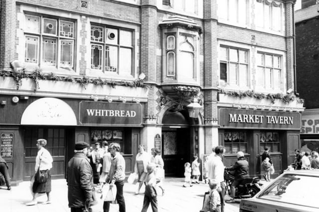 Market Tavern on Exchange Street, Sheffield city centre, in May 1987. The pub's many previous names include Rotherham House, The Sun, Old Number 12, Double 6, The Garden and Bernies Restaurant. It was said to be haunted by a ghost named Charlie.