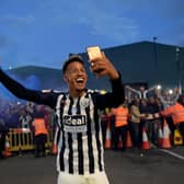 Callum Robinson of West Brom celebrates with the fans after promotion (Photo by Shaun Botterill/Getty Images)