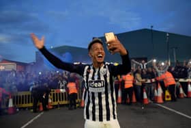 Callum Robinson of West Brom celebrates with the fans after promotion (Photo by Shaun Botterill/Getty Images)
