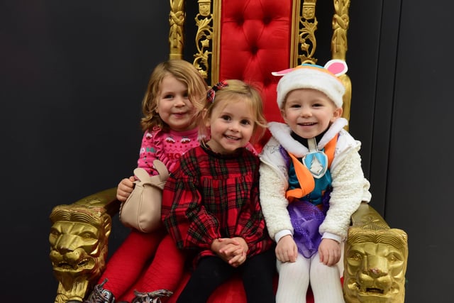Seated on Santa's throne, (left to right): Cara Rycraft (4), Olivia Gibson (3) and Rosa Savage (3).