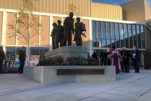 The memorial features seven figures cast in bronze, including a young girl, older man, volunteer, nurse, carer, police officer and a teacher, which represent those affected by the pandemic.