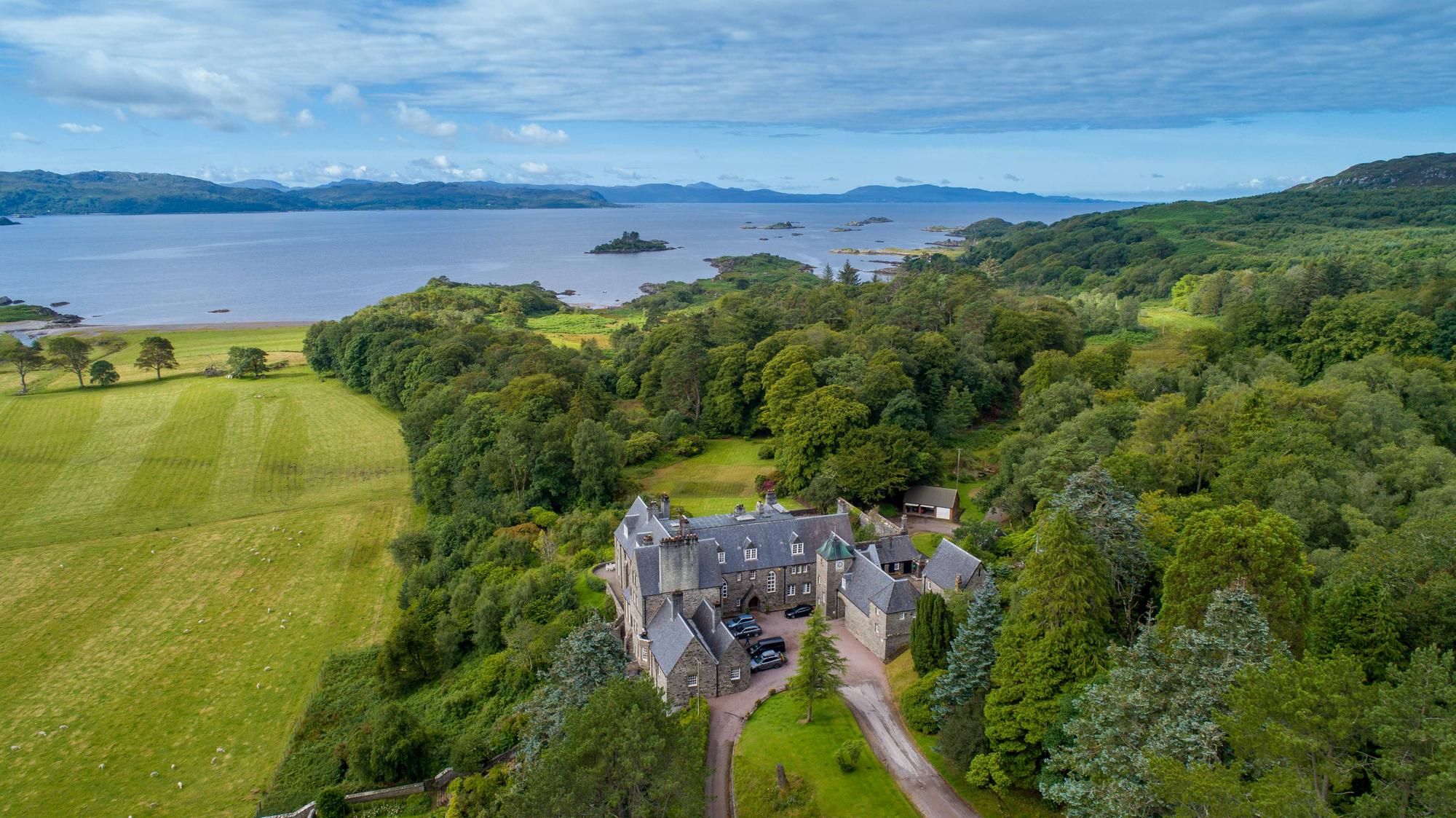 Aerial view of house and estate.