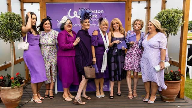 Racegoers supporting Weston Park in their purple attire