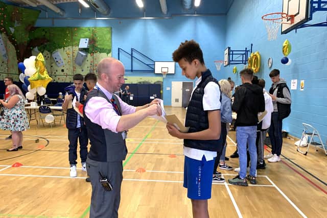 GCSE results day at Firth Park Academy. Firth Park Academy head, Dean Jones, was delighted with the results, and spent the morning chatting to pupils and posing for photographs with them.
