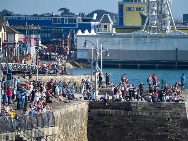 Crowds gather to give HMS Queen Elizabeth a proper send off. Picture: Finnbarr Webster/Getty Images