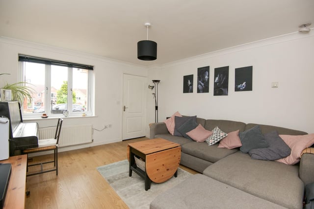The bright, spacious lounge is located near the front of the property and has plenty of space for a large sofa and TV.