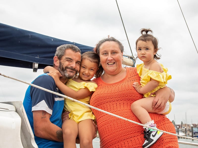 John-Paul Westfield and Annmarie McLaren make use of the warm afternoon to show granddaughters Frankee-Jay (4) and Marleya (1.5) around their boat moored at Milton's Lock Lake Picture: Mike Cooter (150721)