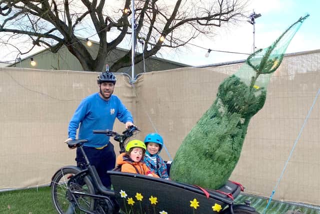 Joss Redfern and children collecting a Christmas tree on his cargo bike
