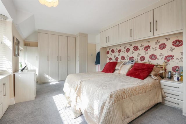 Fitted wardrobes, overhead cupboards and freestanding units keep clothes and personal possessions out of sight.