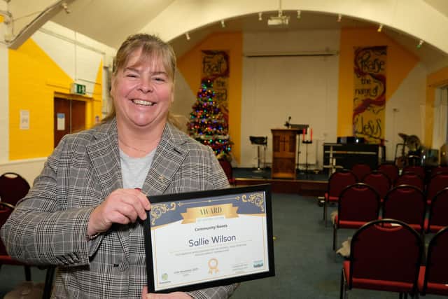 Pastor Sallie Wilson of Church on the Corner, Sheffield, receives an award from Sheffield City Council.