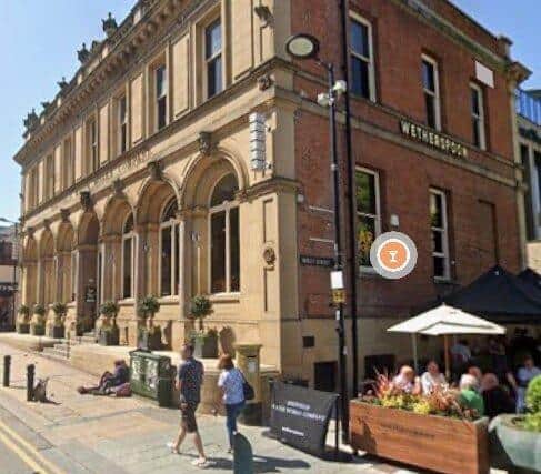 A 2024 Google Maps view of Lloyds No 1 Cafe Bar on Division Street, Sheffield city centre. It is currently covered in scaffolding and hoardings, awaiting repairs