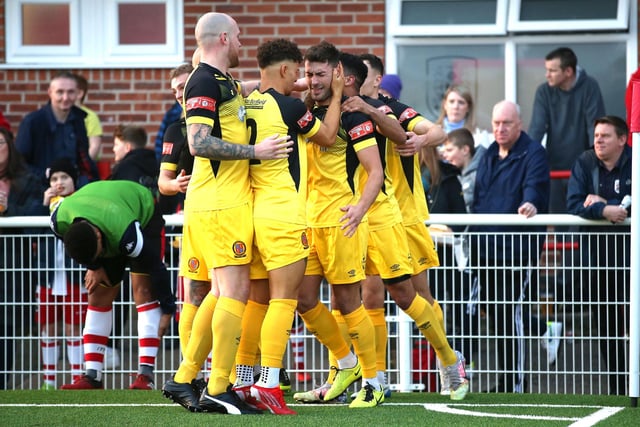 Belper's players congratulate Margetts after his goal.