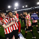 Tommy Doyle (left)  and Rhian Brewster celebrate promotion with Sheffield United: Darren Staples / Sportimage