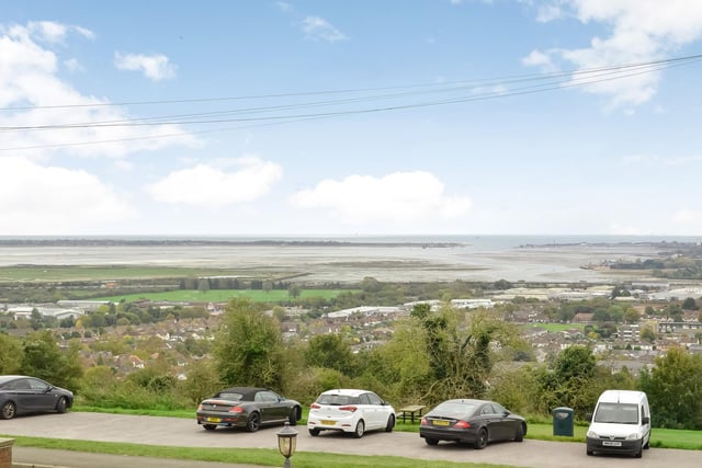 This huge five-bedroom Portsdown Hill home in Portsmouth is up for raffle. Pictured is the property's south-facing front view over Langstone Harbour and the city.