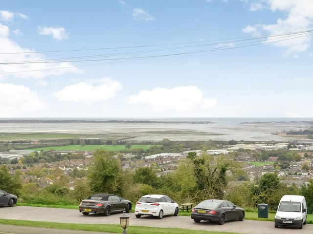 This huge five-bedroom Portsdown Hill home in Portsmouth is up for raffle. Pictured is the property's south-facing front view over Langstone Harbour and the city.