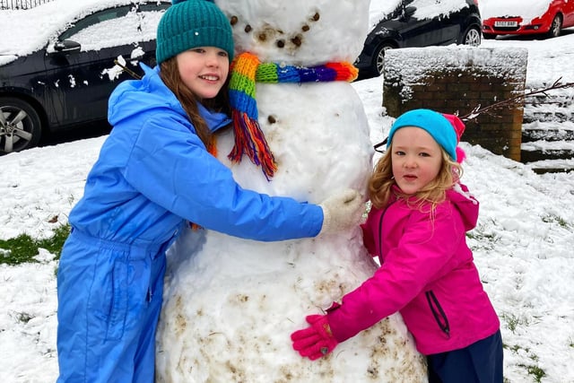 Maisie (age 9) and Belle (age 5) built a giant snowman in Arbourthorne (Photo: Mel Mycroft).