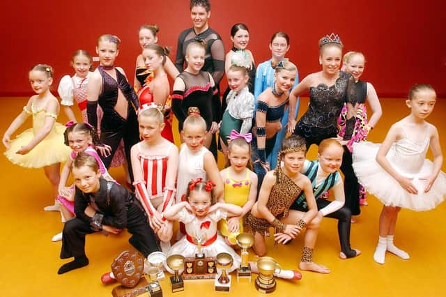 This one goes back to 2005. Are you in the picture at Nadine's Academy of Dance?