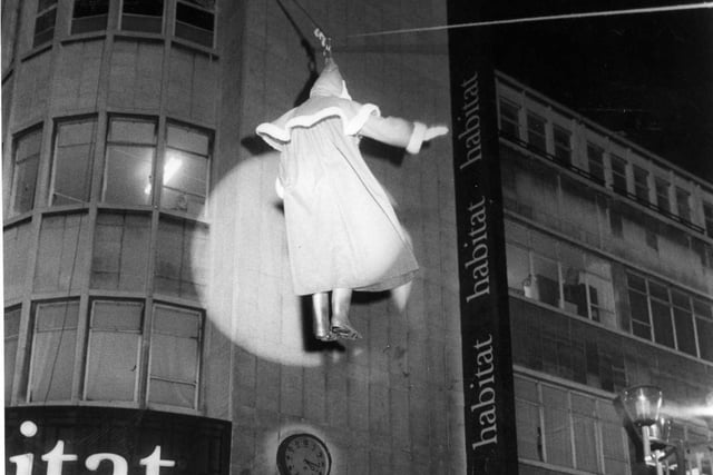 Pictured on the Moor, Sheffield where Father Christmas is seen arriving for the lights switch on ceremony, he is lowered form the roof tops on a wire on November 24, 1983.