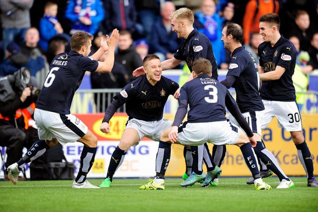 John Baird celebrates with his teammates after putting Falkirk 1-0 up from the penalty spot just three minutes in to the match