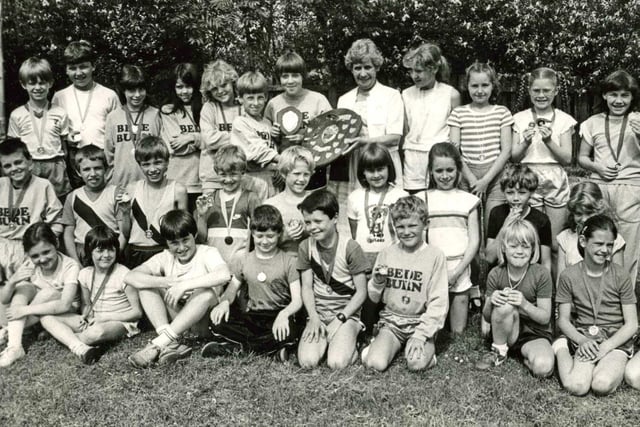 Bede Burn Junior School was presented with the Jarrow and Hebburn Schools Athletic Shield in 1985.  Girls captain, Judith Holtham and boys captain, Simon Barclay were among the smiling faces.