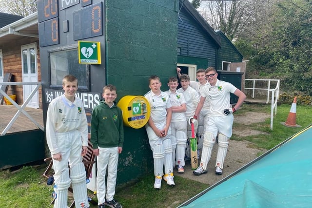 Players and family have raised money for a life saving defibilator taken by Bradfield Junior Cricket Club