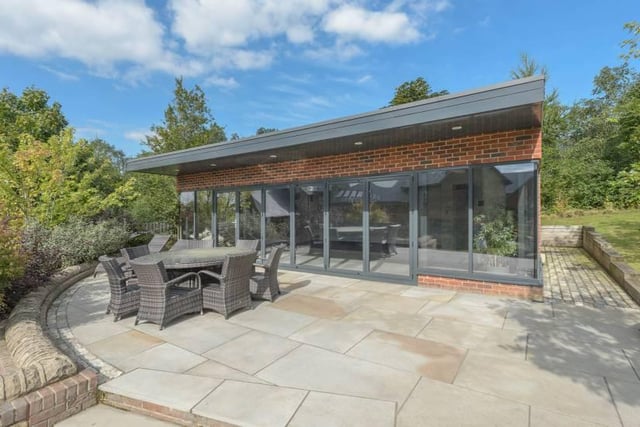 "The fully detached garden room with raised sun terrace also boasts an endless pool."