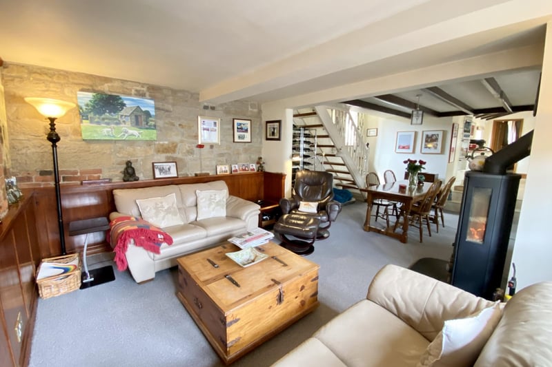 The property has four reception rooms and three wood burning stoves
