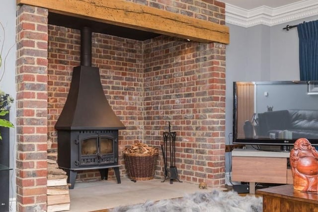 The log-burning stove, set in a feature inglenook fireplace, in the main lounge.
