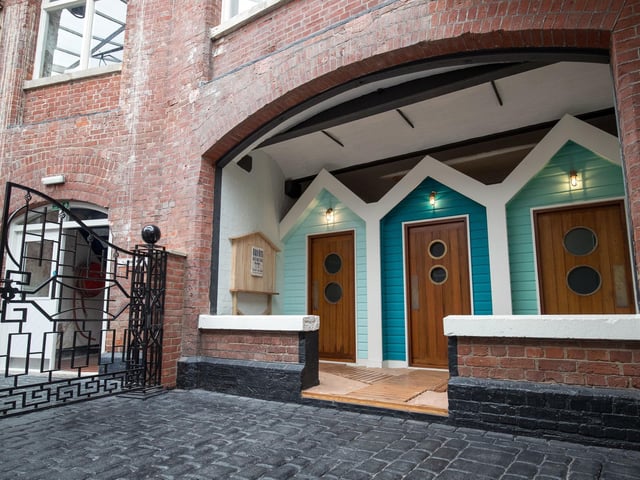 Beach hut styled changing rooms for spa guests staying at No Man's Fort