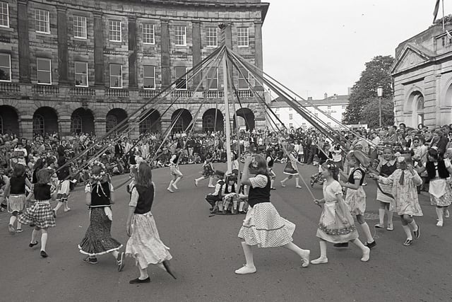 Buxton Advertiser archive, 1978, maypole dancing in the Crescent as part of the well dressing celebrations