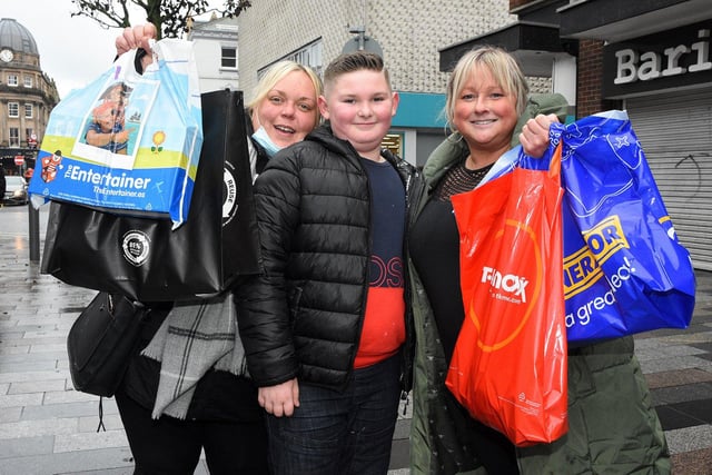 Donna Black, son Jayden, 10 and friend Emma Whitfield from Ryhope heading home from the city centre after buying some last minute festive gifts.