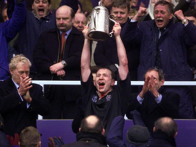 Scotland captain Andy Nicol holds aloft the Calcutta Cup after Scotland defeat England 19-13 at Murrayfield, 2 April 2000.