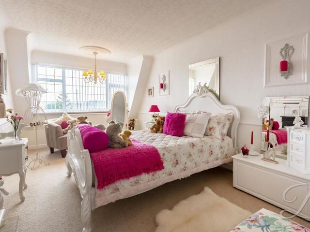 This is the biggest of the three bedrooms at the £400,000 property. The floor is carpeted and the window overlooks the front.